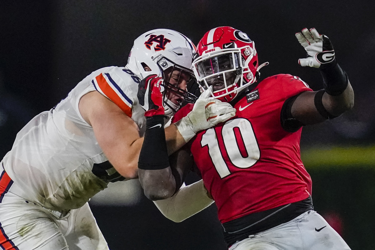 Oct 3, 2020; Athens, Georgia, USA; Auburn Tigers offensive lineman Austin Troxell (68) and Georgia Bulldogs defensive lineman Malik Herring (10) battle along the line during the second half at Sanford Stadium. Mandatory Credit: Dale Zanine-USA TODAY Sports